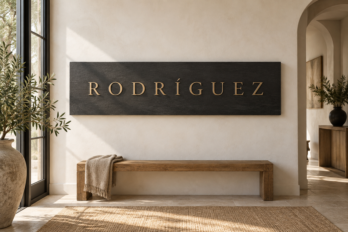 Rodríguez surname on a wide charcoal plaque above an oak hallway bench; AI-generated concept.